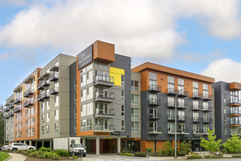 exterior building view showing balconies and parking garage entrance